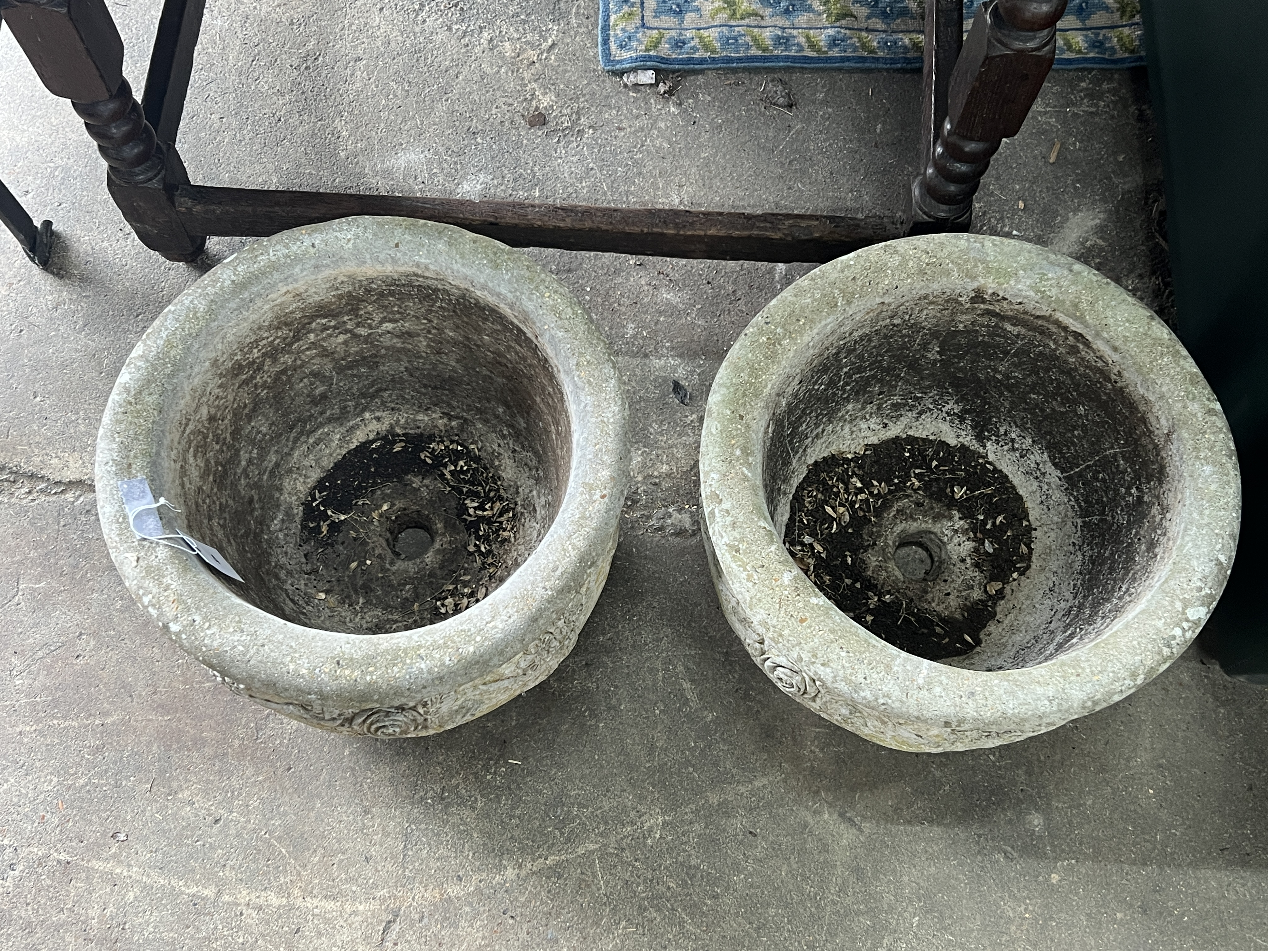 A pair of circular reconstituted stone garden planters, diameter 37cm, height 26cm